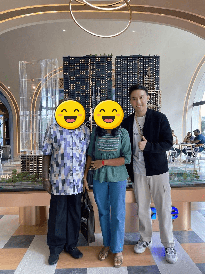 Jeremy Lee with clients at a Kuala Lumpur property gallery