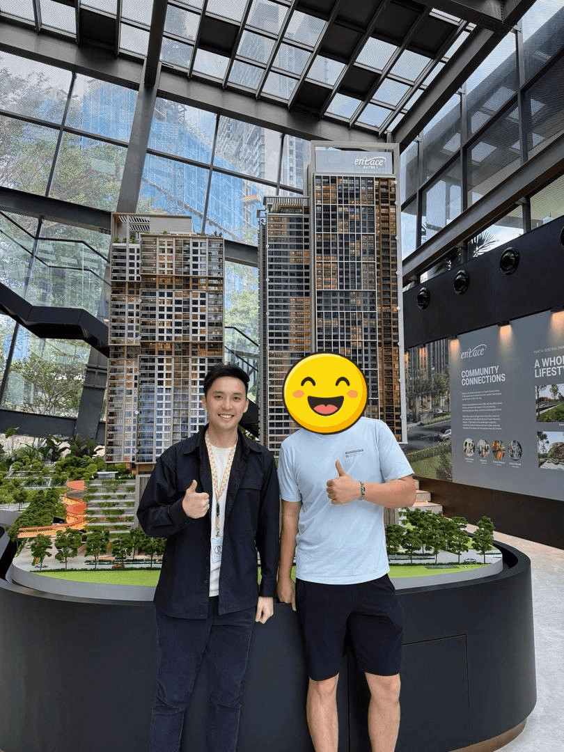 Jeremy Lee with a client beside a development model